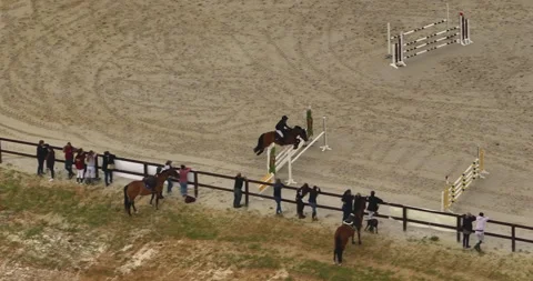 Aerial view. Cinematic slow motion close up of young female horsemanship master 库存影片 250362573