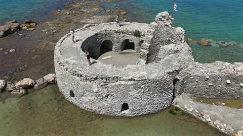 Aerial view circle pan left around ancient ruins of Venetian castle in the Stock Footage 331057381