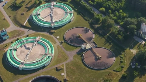 Aerial view of circular clarifiers and aeration tanks at a wastewater treatment Stock Footage 344879655