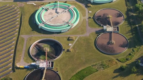 Aerial view of circular clarifiers in a wastewater treatment plant Stock Footage 344879686