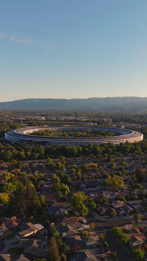 Aerial view of circular corporate campus headquarters in Cupertino Stock Footage 346242551