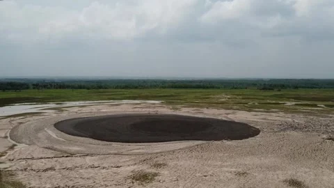 Aerial view of circular dark patch at The Kesongo mud volcanno area Video stock 279754351