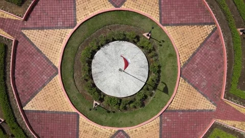 Aerial view of a circular garden showcasing the Indonesian flag Stockbeeldmateriaal 288410375