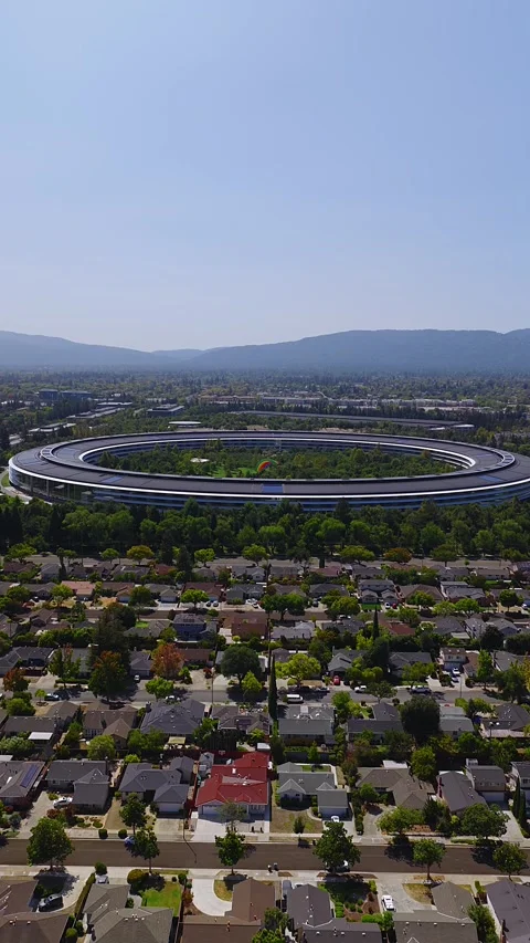 Aerial view of circular headquarters and suburb in Cupertino Stock Footage 346242578