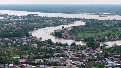 Aerial view of a circular river in Kalimantan near the harbor Stock Footage 333023932