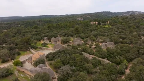 Aerial view of circular stone huts from above in Village des Bories, France Stock Footage 313149843