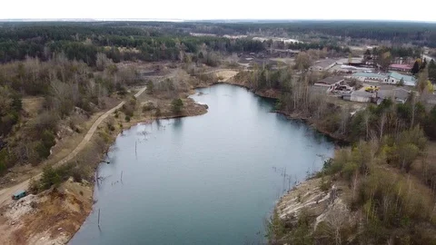 Aerial view circular view of landscape of forests and lakes with mountains Stock Footage 129658431
