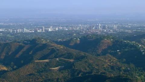 Aerial view of city and mountains on a sunny day in Los Angeles, California. Sho Stock-Footage 199461953