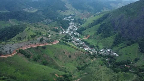 Aerial view of a city between the mountains on the countryside in Brazil Stock Footage 239578908