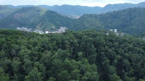 Aerial view of a city between the mountains in Brazil Stock Footage 239579136