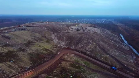 Aerial View of City Garbage Dump and Village behind it. Video stock 143356058