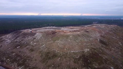 Aerial View of City Garbage Dump and factories in the background. Video stock 143614713