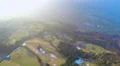 Aerial view, city in green valley at mountain bottom, environmental protection 4k or 4k+ Resolution