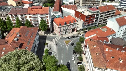 Aerial View of a City Intersection Near a Historic Clock Tower Stock-Footage 345840368
