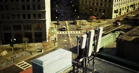 Aerial view of a city intersection with rooftop telecom equipment Stock Illustration