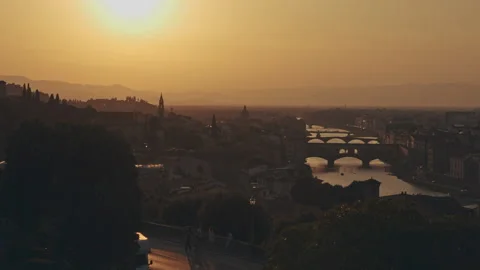 Aerial view of city landscape with setting sun. Panorama of river flowing Stock Footage 160983129