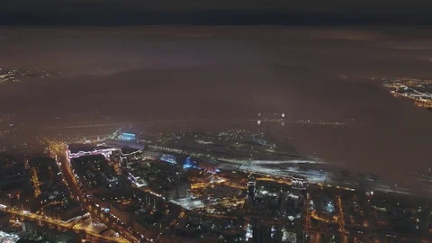 Aerial view of the city in the low clouds skyscrapers Moscow city at night Stock Footage 104301258