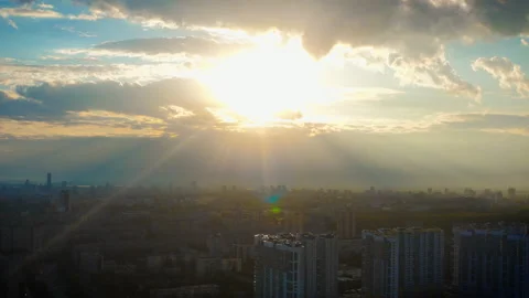 Aerial view of the city in the rays of the bright sun at sunset Stock Footage 145681597