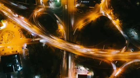 Aerial View of a City Road Junction with Traffic at Night 스톡 동영상 342134258