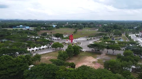 Aerial view of city square roundabout with traffic activity and dense settl.. Stock Footage 296461819