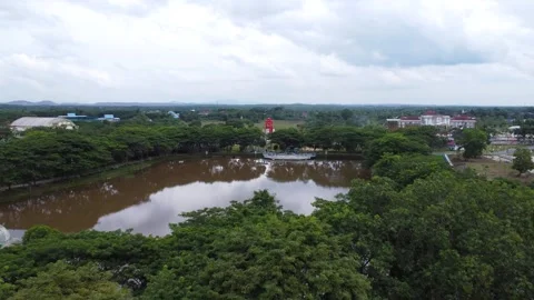 Aerial view of city square roundabout with traffic activity and dense settl.. Stock Footage 296462249