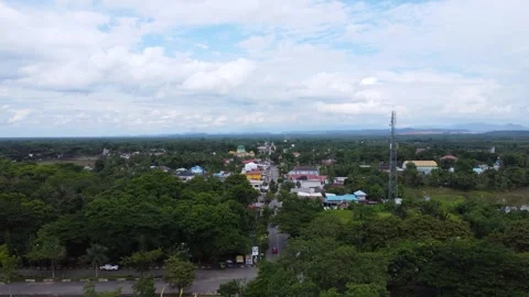 Aerial view of city square roundabout with traffic activity and dense settl.. Stock Footage 296464723