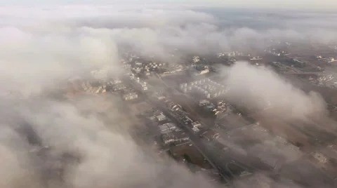 Aerial view of city through the clouds Stock Footage 64657475