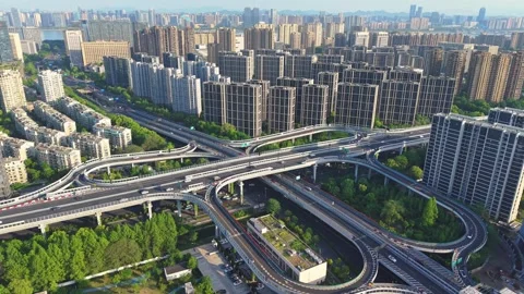 Aerial view of city traffic flow on elevated roads and intersections in a modern Stock Footage 309084972