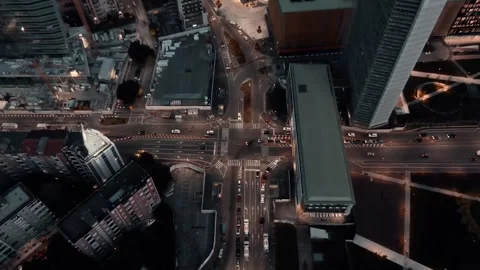 Aerial view of city traffic intersection at night with high angle drone mov.. Stock Footage 334704069