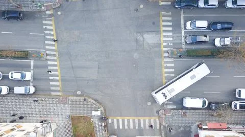 Aerial view of the city traffics at the center. Vehicles are moving on the road Stock Photos