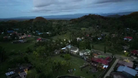 Aerial view of city, which gradually plunges into twilight. Evening landscape Stock Footage 233229646