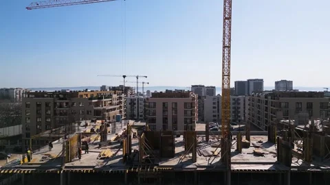 Aerial view of a cityscape with ongoing construction projects and completed Stock Footage 304083615