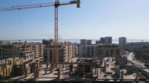 Aerial view of a cityscape with ongoing construction projects and completed Video stock 304084542