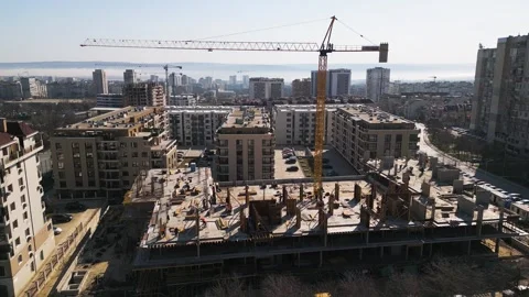 Aerial view of a cityscape with ongoing construction projects and completed Video stock 304085382