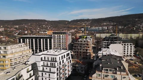 Aerial view of a cityscape with ongoing construction projects and completed Video stock 304090116