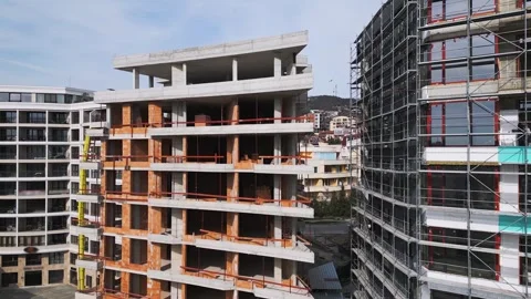 Aerial view of a cityscape with ongoing construction projects and completed Video stock 304099401