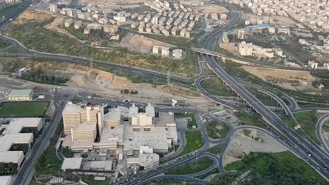 Aerial view cityscape of Tehran metropolis with mountains in background Stock Footage 69938128
