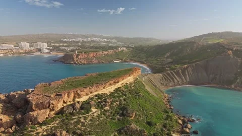 Aerial view of Clay Cliffs and Qarraba Bay at Riviera Beach, Malta's 動画素材 330833359