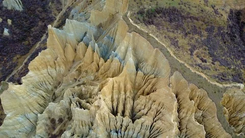 Aerial view of clay cliffs, rock formations in Omarama, New Zealand 스톡 동영상 99365396
