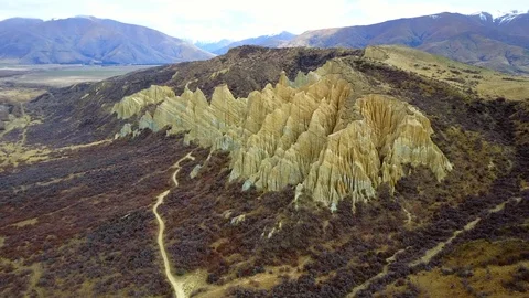 Aerial view of clay cliffs, rock formations in Omarama, New Zealand Stock-Footage 99366479