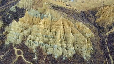 Aerial view of clay cliffs, rock formations in Omarama, New Zealand Stock-Footage 99670763