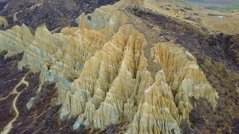 Aerial view of clay cliffs, rock formations in Omarama, New Zealand Stock-Footage 99670901