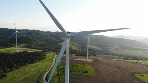 Aerial view of clean and renewable wind power farm in motion konverting kinetic Stock Footage
