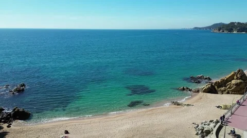 Aerial view of clean beach and transparent calm sea in Lloret de Mar, 4K Stock Footage 274852215