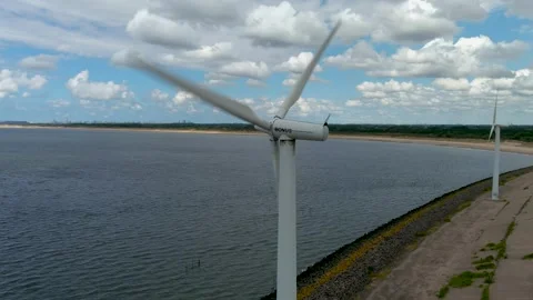 Aerial view of clean power generating wind turbines. Video stock 275274302