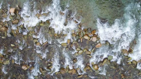 Aerial View of Clear Mountain Stream Flowing Over Smooth River Rocks Stock Footage 342325875