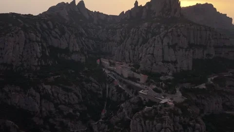 Aerial view of a cliff monastery with setting sun 스톡 동영상 343325290