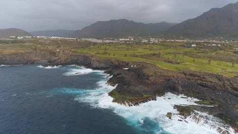 Aerial view of cliffs and Atlantic ocean on Tenerife, drone shot from above Stock Footage 97709592