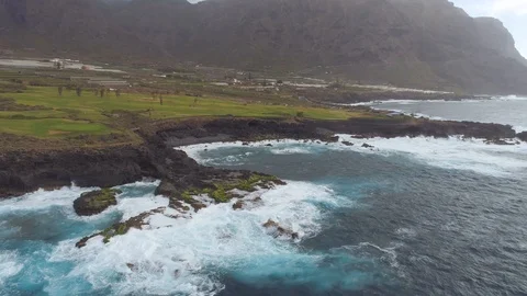 Aerial view of cliffs and Atlantic ocean on Tenerife, drone shot from above Stock Footage 97710866