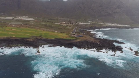 Aerial view of cliffs and Atlantic ocean on Tenerife, drone shot from above Stock Footage 97711059